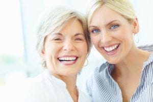 Mother and Daughter With Beautiful Smiles