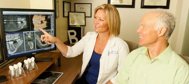 Dr. Beck Reviewing Dental Xrays with Patient | Tina Beck, DDS