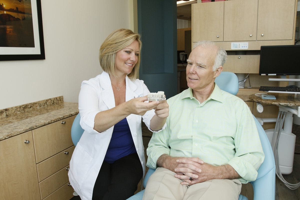 Dr. Beck Explaining Dental Implants to Mature Male Patient