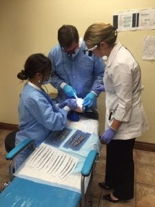 Dr. Beck Instructing Two Students