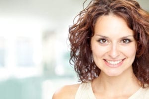 beautiful brunette girl smile portrait in a interior background