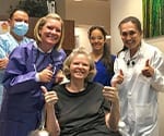 Dr. Beck Giving Thumbs Up with Patient and Team