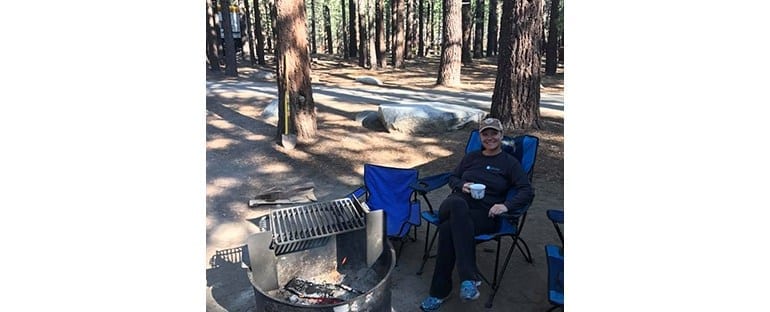 Dr. Beck Sitting at a Campsite